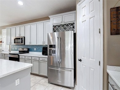 Stunning 5-Bedroom Pool Home on Expansive Corner Lot with Water on Oaks National Golf Course in Florida - for sale on GolfHomes.com, golf home, golf lot
