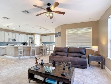 Stunning 5-Bedroom Pool Home on Expansive Corner Lot with Water on Oaks National Golf Course in Florida - for sale on GolfHomes.com, golf home, golf lot