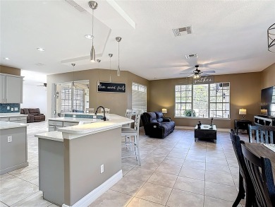 Stunning 5-Bedroom Pool Home on Expansive Corner Lot with Water on Oaks National Golf Course in Florida - for sale on GolfHomes.com, golf home, golf lot