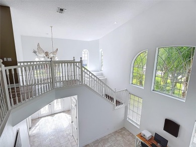 Stunning 5-Bedroom Pool Home on Expansive Corner Lot with Water on Oaks National Golf Course in Florida - for sale on GolfHomes.com, golf home, golf lot