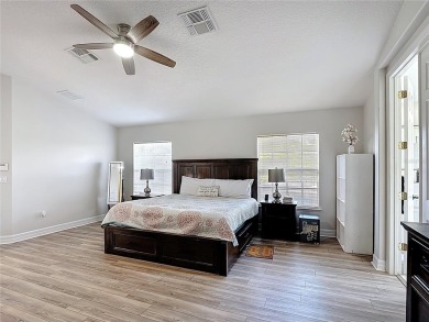 Stunning 5-Bedroom Pool Home on Expansive Corner Lot with Water on Oaks National Golf Course in Florida - for sale on GolfHomes.com, golf home, golf lot