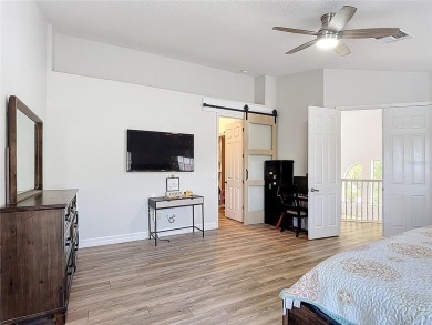 Stunning 5-Bedroom Pool Home on Expansive Corner Lot with Water on Oaks National Golf Course in Florida - for sale on GolfHomes.com, golf home, golf lot