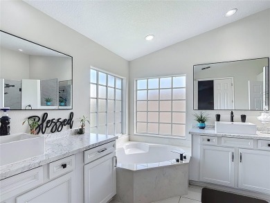 Stunning 5-Bedroom Pool Home on Expansive Corner Lot with Water on Oaks National Golf Course in Florida - for sale on GolfHomes.com, golf home, golf lot