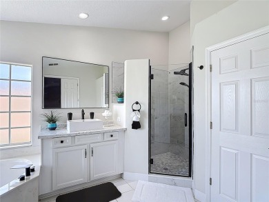 Stunning 5-Bedroom Pool Home on Expansive Corner Lot with Water on Oaks National Golf Course in Florida - for sale on GolfHomes.com, golf home, golf lot