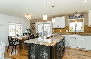 Spacious split-level home featuring 5 bedrooms and 2 bathrooms on Dodge Country Club in Minnesota - for sale on GolfHomes.com, golf home, golf lot