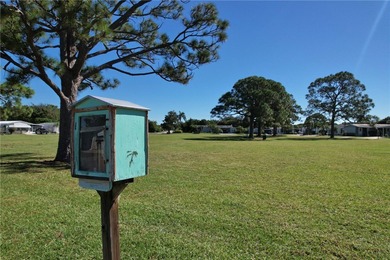 Fully furnished home located across from the golf course on Barefoot Bay Golf Course in Florida - for sale on GolfHomes.com, golf home, golf lot