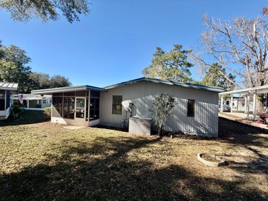 Home is located in Water Oak Country Club Estates, an active 55 on Water Oak Country Club Estates in Florida - for sale on GolfHomes.com, golf home, golf lot