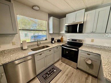 Home is located in Water Oak Country Club Estates, an active 55 on Water Oak Country Club Estates in Florida - for sale on GolfHomes.com, golf home, golf lot