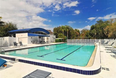 Under contract-accepting backup offers. This spacious lakefront on University Park Country Club in Florida - for sale on GolfHomes.com, golf home, golf lot