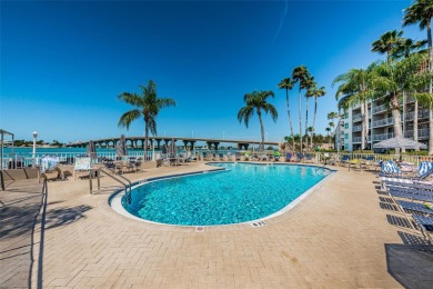 Welcome to paradise! Enter the light and bright condo and drink on Isla Del Sol Yacht and Country Club in Florida - for sale on GolfHomes.com, golf home, golf lot