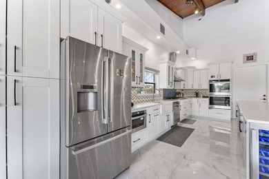 Modern yet inviting, this reimagined residence offers 2,897 sqft on Ocean Breeze Golf and Country Club in Florida - for sale on GolfHomes.com, golf home, golf lot