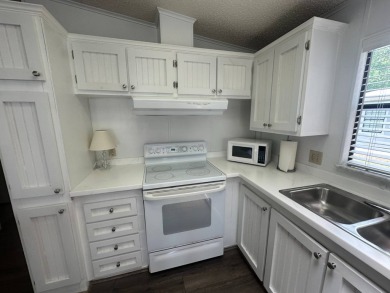 This well-cared for home is located only steps from one of the on Del Tura Golf and Country Club in Florida - for sale on GolfHomes.com, golf home, golf lot