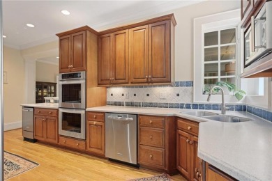 Charming brick and stone beauty nestled in the heart of on Bobby Jones Golf Club in Georgia - for sale on GolfHomes.com, golf home, golf lot