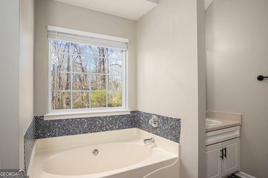 Welcome home to this charming 3-bedroom, 2-bath ranch nestled in on Monroe Golf and Country Club in Georgia - for sale on GolfHomes.com, golf home, golf lot