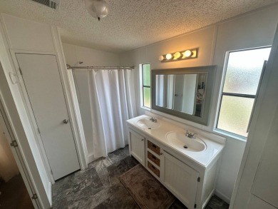 This well-cared for home is located only steps from one of the on Del Tura Golf and Country Club in Florida - for sale on GolfHomes.com, golf home, golf lot