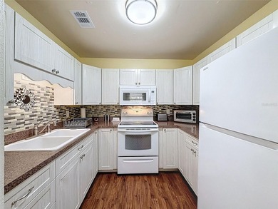 Check out this amazing single-story condo in a pet-friendly 55+ on Summertree Golf Course in Florida - for sale on GolfHomes.com, golf home, golf lot