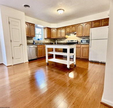 Well kept townhome in convenient location. Large Primary bedroom on Bel Meadow Country Club in West Virginia - for sale on GolfHomes.com, golf home, golf lot