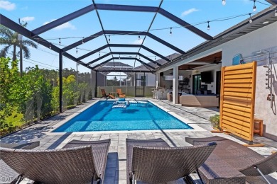 Exquisite modern contemporary 4 Bedroom 3 bath pool home in on Royal Tee Country Club in Florida - for sale on GolfHomes.com, golf home, golf lot