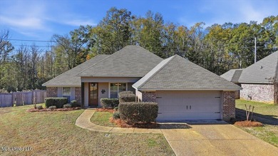 This thoughtfully designed home features quality construction on Patrick Farms Golf Club in Mississippi - for sale on GolfHomes.com, golf home, golf lot
