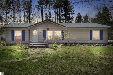 This 3-bedroom, 2-bath home in Kalkaska's Drydock community on Twin Birch Golf Club in Michigan - for sale on GolfHomes.com, golf home, golf lot