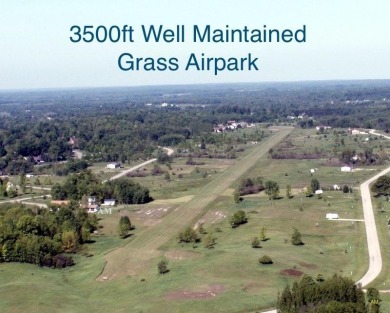 Live with your plane on this .83-acre lot off the Sugar Springs on Sugar Springs Country Club in Michigan - for sale on GolfHomes.com, golf home, golf lot