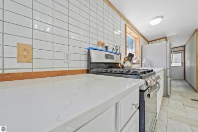 This 3-bedroom, 2-bath home in Kalkaska's Drydock community on Twin Birch Golf Club in Michigan - for sale on GolfHomes.com, golf home, golf lot