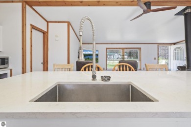 This 3-bedroom, 2-bath home in Kalkaska's Drydock community on Twin Birch Golf Club in Michigan - for sale on GolfHomes.com, golf home, golf lot