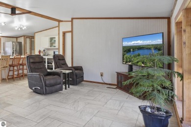 This 3-bedroom, 2-bath home in Kalkaska's Drydock community on Twin Birch Golf Club in Michigan - for sale on GolfHomes.com, golf home, golf lot
