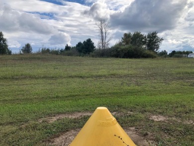 Live with your plane on this .83-acre lot off the Sugar Springs on Sugar Springs Country Club in Michigan - for sale on GolfHomes.com, golf home, golf lot