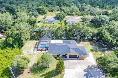 5 BED 3 BATH WATERFRONT CANAL POOL HOME WITH WATER ACCESS TO THE on Deep Creek Golf Club in Florida - for sale on GolfHomes.com, golf home, golf lot