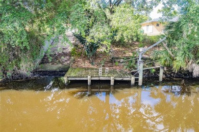 5 BED 3 BATH WATERFRONT CANAL POOL HOME WITH WATER ACCESS TO THE on Deep Creek Golf Club in Florida - for sale on GolfHomes.com, golf home, golf lot