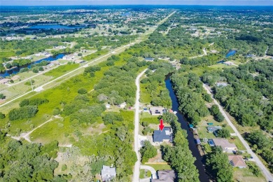 5 BED 3 BATH WATERFRONT CANAL POOL HOME WITH WATER ACCESS TO THE on Deep Creek Golf Club in Florida - for sale on GolfHomes.com, golf home, golf lot