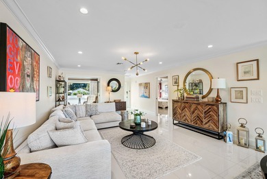 Beautifully reimagined 2-bedroom plus den residence, ideally on Quail Ridge Golf Course and Country Club in Florida - for sale on GolfHomes.com, golf home, golf lot