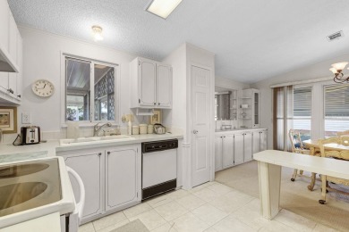 Enjoy golf course views from this well-maintained 2-bedroom on Orange Blossom Hills Golf and Country Club in Florida - for sale on GolfHomes.com, golf home, golf lot