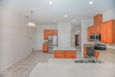 Welcome to this beautifully maintained Brick 4-bedroom on Golf Club At Fleming Island in Florida - for sale on GolfHomes.com, golf home, golf lot