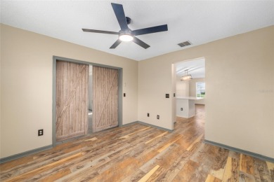 This modified Austin Model in the Village of Alhambra is priced on The Links of Spruce Creek in Florida - for sale on GolfHomes.com, golf home, golf lot