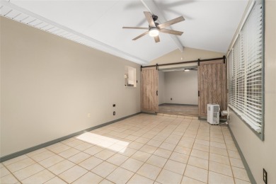 This modified Austin Model in the Village of Alhambra is priced on The Links of Spruce Creek in Florida - for sale on GolfHomes.com, golf home, golf lot