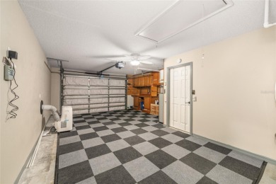 This modified Austin Model in the Village of Alhambra is priced on The Links of Spruce Creek in Florida - for sale on GolfHomes.com, golf home, golf lot