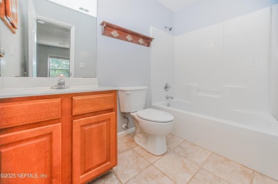Welcome to this beautifully maintained Brick 4-bedroom on Golf Club At Fleming Island in Florida - for sale on GolfHomes.com, golf home, golf lot