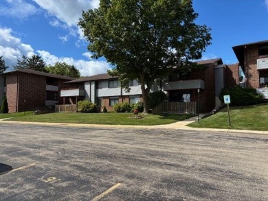 Spacious 2 bedroon, 2 bath upper level Condominium with Golf on Tuckaway Country Club in Wisconsin - for sale on GolfHomes.com, golf home, golf lot