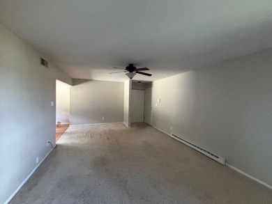 Spacious 2 bedroon, 2 bath upper level Condominium with Golf on Tuckaway Country Club in Wisconsin - for sale on GolfHomes.com, golf home, golf lot