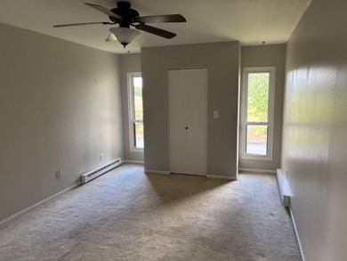 Spacious 2 bedroon, 2 bath upper level Condominium with Golf on Tuckaway Country Club in Wisconsin - for sale on GolfHomes.com, golf home, golf lot