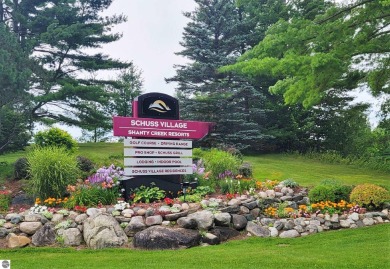 This is a sharp two-bedroom condominium located within 500 feet on Schuss Mountain Golf Club in Michigan - for sale on GolfHomes.com, golf home, golf lot