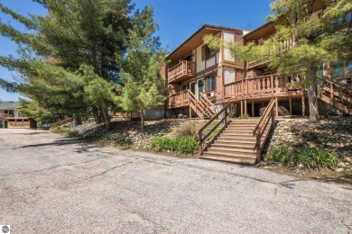 This is a sharp two-bedroom condominium located within 500 feet on Schuss Mountain Golf Club in Michigan - for sale on GolfHomes.com, golf home, golf lot