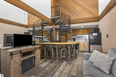 This is a sharp two-bedroom condominium located within 500 feet on Schuss Mountain Golf Club in Michigan - for sale on GolfHomes.com, golf home, golf lot