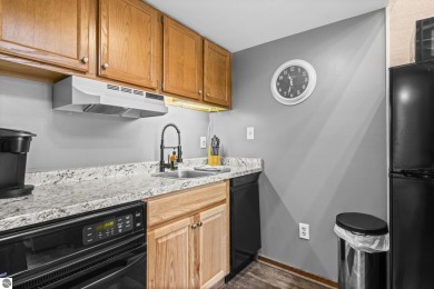 This is a sharp two-bedroom condominium located within 500 feet on Schuss Mountain Golf Club in Michigan - for sale on GolfHomes.com, golf home, golf lot
