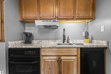 This is a sharp two-bedroom condominium located within 500 feet on Schuss Mountain Golf Club in Michigan - for sale on GolfHomes.com, golf home, golf lot