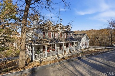 This stunning two-story home offers over 4,000 square feet of on Raintree Country Club in Missouri - for sale on GolfHomes.com, golf home, golf lot