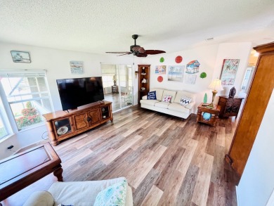 This two-bedroom, two-bathroom home in the gated golf community on Pine Lakes Country Club in Florida - for sale on GolfHomes.com, golf home, golf lot