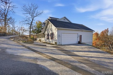 This stunning two-story home offers over 4,000 square feet of on Raintree Country Club in Missouri - for sale on GolfHomes.com, golf home, golf lot